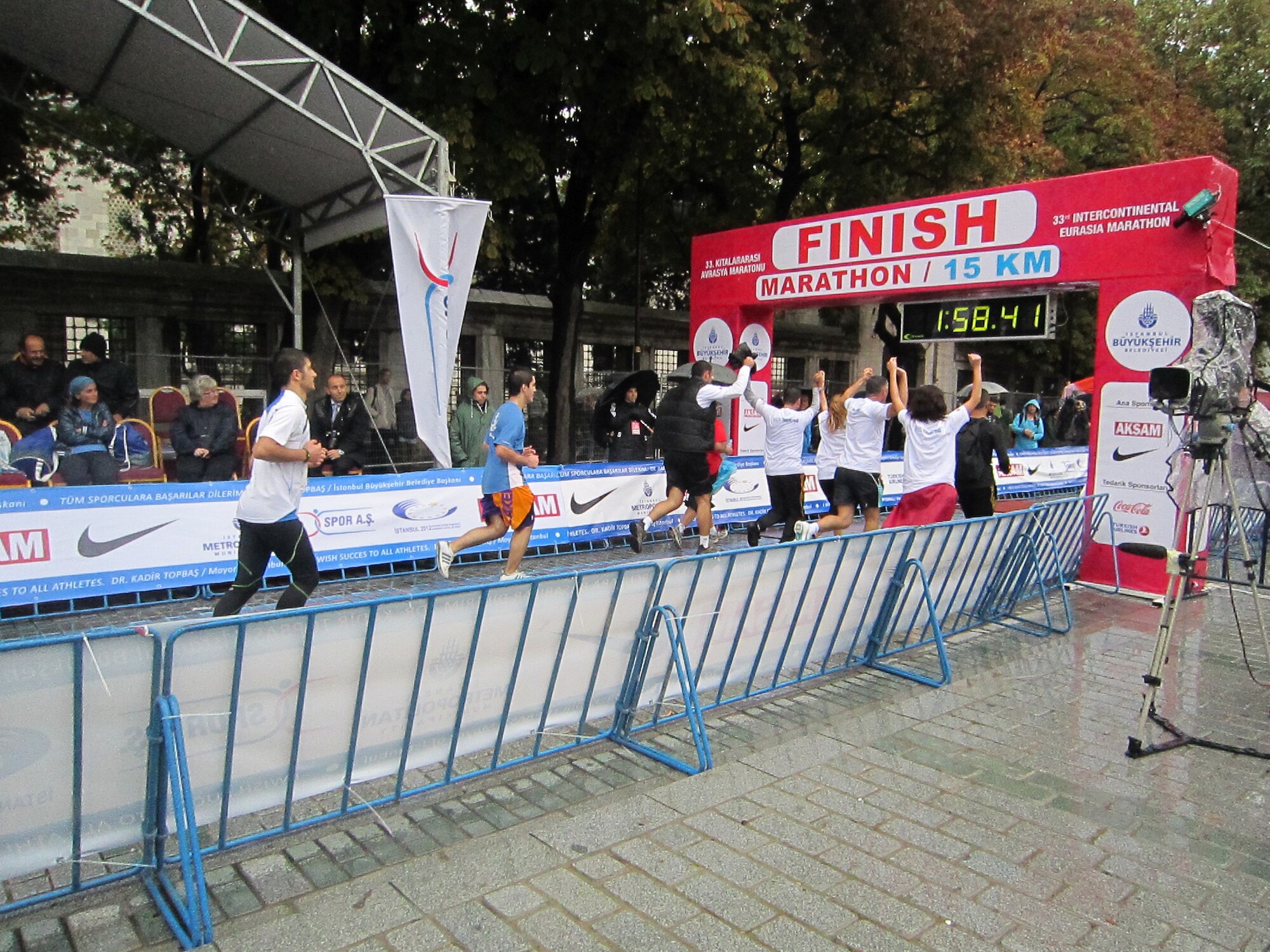 Race participants celebrate as they cross the finish line during the 15k portion of the Intercontinental Istanbul Eurasia Marathon and associated events Oct. 16, 2011. Approximately 30 people from the base traveled nearly 600 miles to participate in the events, which included a marathon, 15K, 8K and fun run. Race participants traversed the Boshporus Bridge, which connects Asia to Europe, making the race a unique experience to run from one continent to another.  (U.S. Air Force photo by Staff Sgt. Kali L. Gradishar/Released)