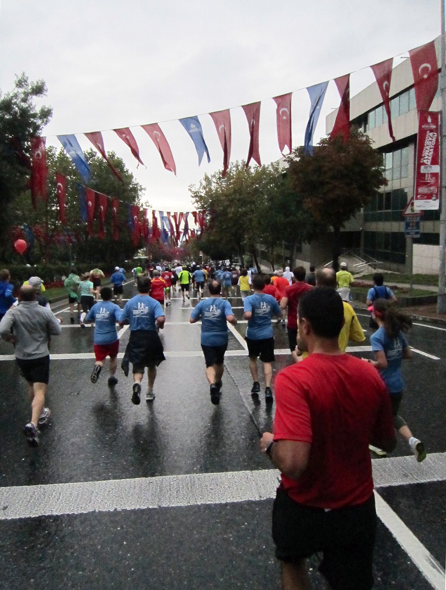 Members of Team Incirlik and other race participants run down the streets of Istanbul during the Intercontinental Istanbul Eurasia Marathon and associated events Oct. 16, 2011. Approximately 30 people from the base traveled nearly 600 miles to participate in the events, which included a marathon, 15K, 8K and fun run. Race participants traversed the Boshporus Bridge, which connects Asia to Europe, making the race a unique experience to run from one continent to another.  (U.S. Air Force photo by Staff Sgt. Kali L. Gradishar/Released)