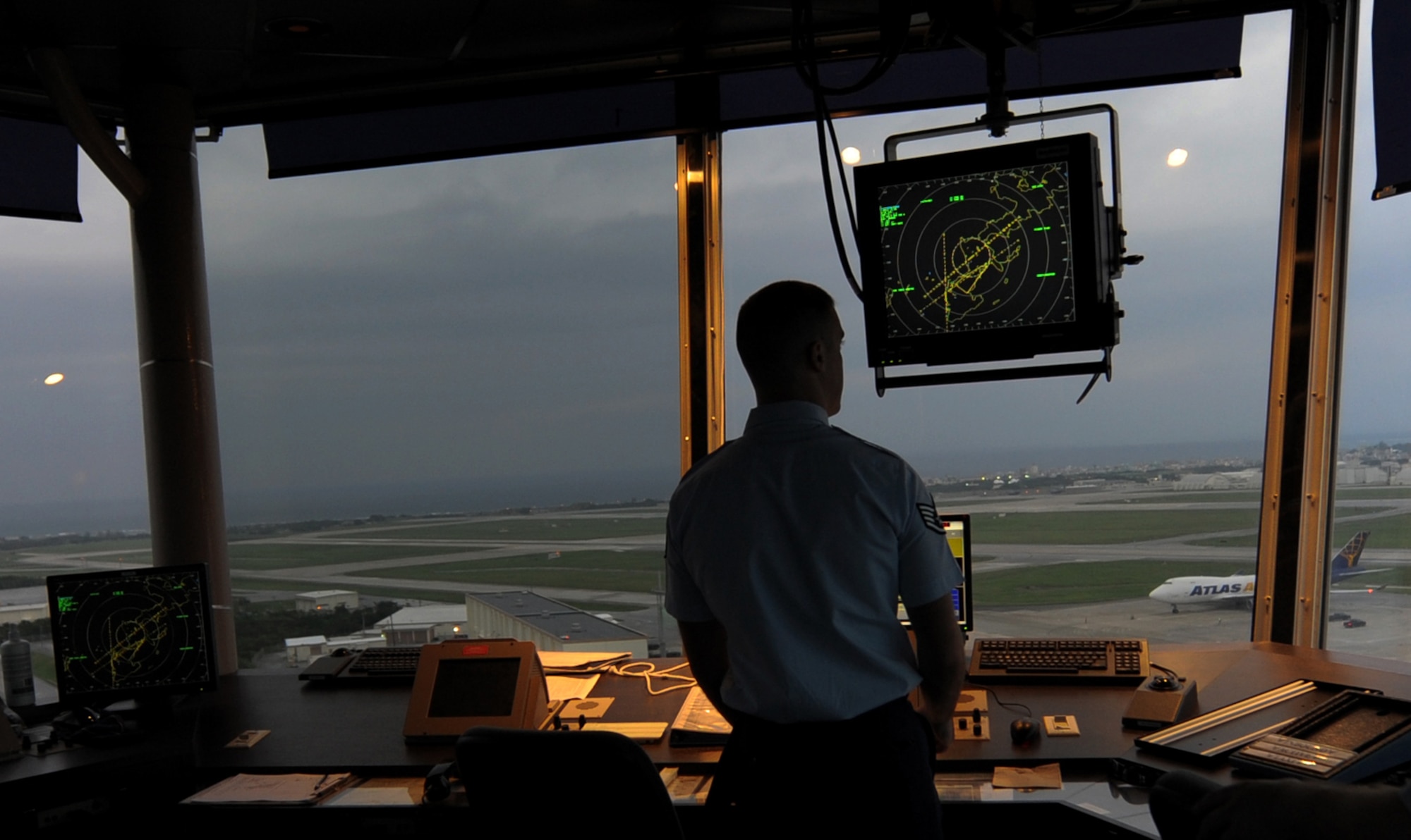 U.S. Air Force Staff Sgt. James Lacy, 18th Operations Support Squadron air traffic controller, looks over the flight line while waiting for an aircraft to land on Kadena Air Base, Oct. 17. Air traffic controllers go through extensive training so they can help flight missions run smoothly and efficiently. (U.S. Air Force photo/Airman 1st Class Jarvie Z. Wallace)
