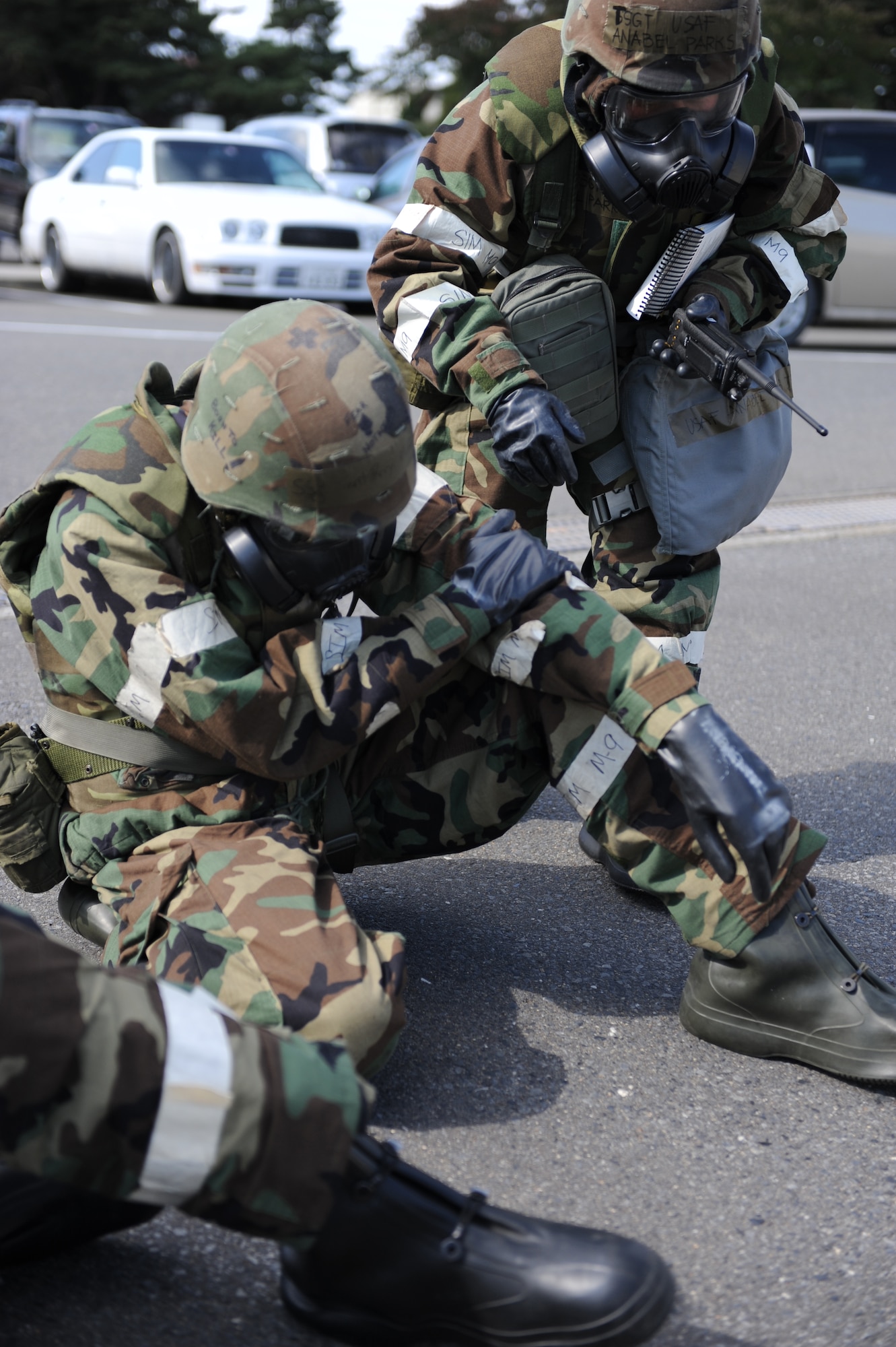 MISAWA AIR BASE, Japan -- Tech. Sgt. Anabel Parks, right, 35th Dental Squadron, checks on simulated victim Staff Sgt. Trent Perry, 35th Medical Support Squadron, during an operational readiness exercise here Oct. 18. Readiness exercises ensure military personnel are capable of following appropriate protocol during real-world combat situations. (U.S. Air Force photo by Airman 1st Class Kia Atkins)