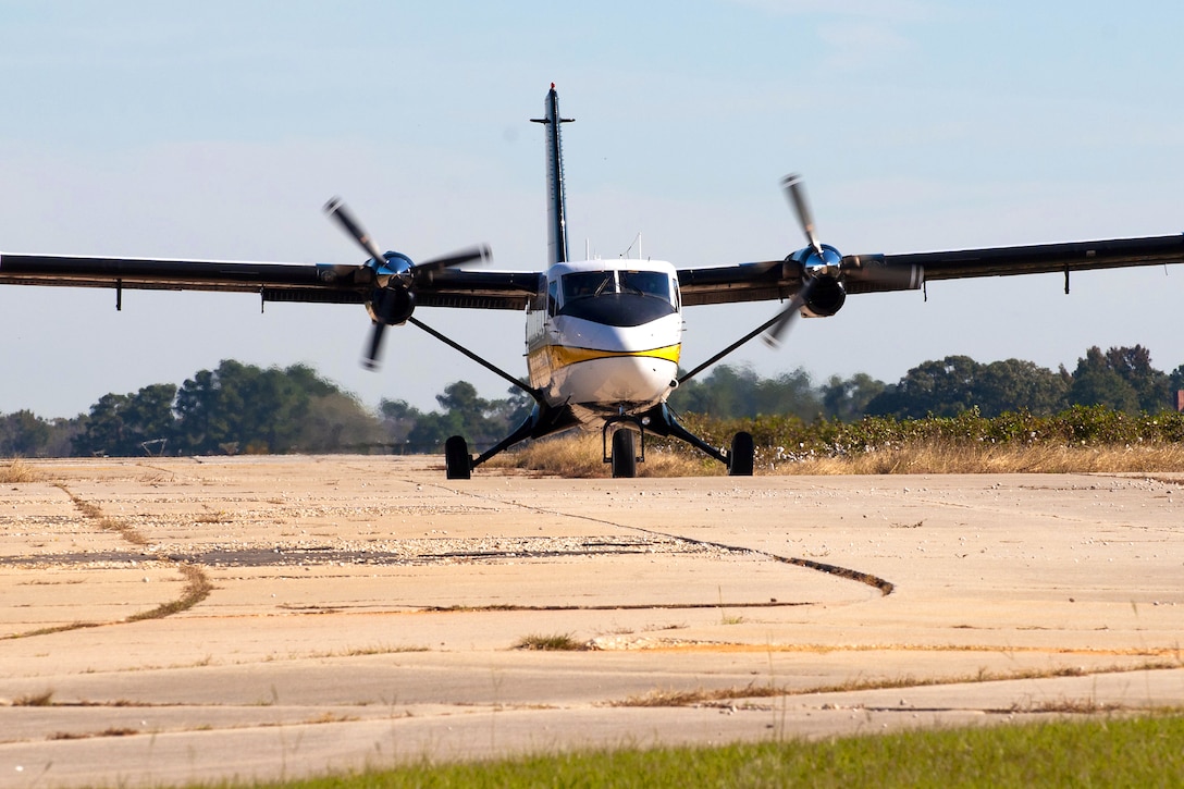 An Army Golden Knights Parachute Team DHC-6 DeHavilland Twin Otter aircraft approaches to pick up jumpers at the Laurinburg-Maxton Airport near Laurinburg, N.C., Oct. 17, 2011. Golden Knight tandem instructors typically jump five times a day while parachutists with the competition teams jump 10 times a day.