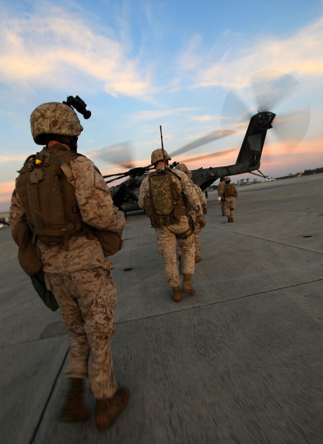 U.S. Marines with Bravo Company, 1st Battalion, 2nd Marine Regiment, board a CH-53E Super Stallion at Marine Corps Air Station New River prior to conducting a practice raid during the Vertical Assault Course aboard Camp Lejeune, N.C., Oct. 19, 2011. The Vertical Assault Course took place Oct. 10-21 to provide Marines and Sailors of Bravo Co. familiarization with air operations for their upcoming deployment as part the Battalion Landing Team for the 24th Marine Expeditionary Unit.