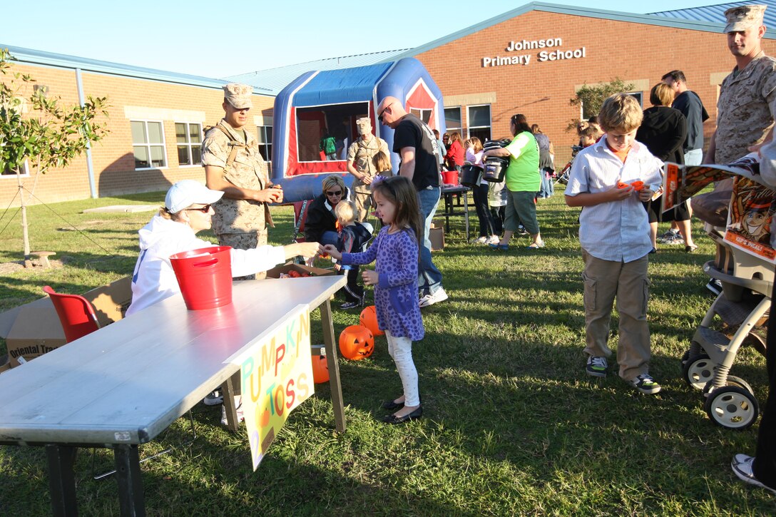 Children waited for their turn to try the pumpkin toss during Johnson Primary School’s annual Fall Festival aboard Marine Corps Base Camp Lejeune, Oct. 20. Children painted their faces, played games and won prizes.