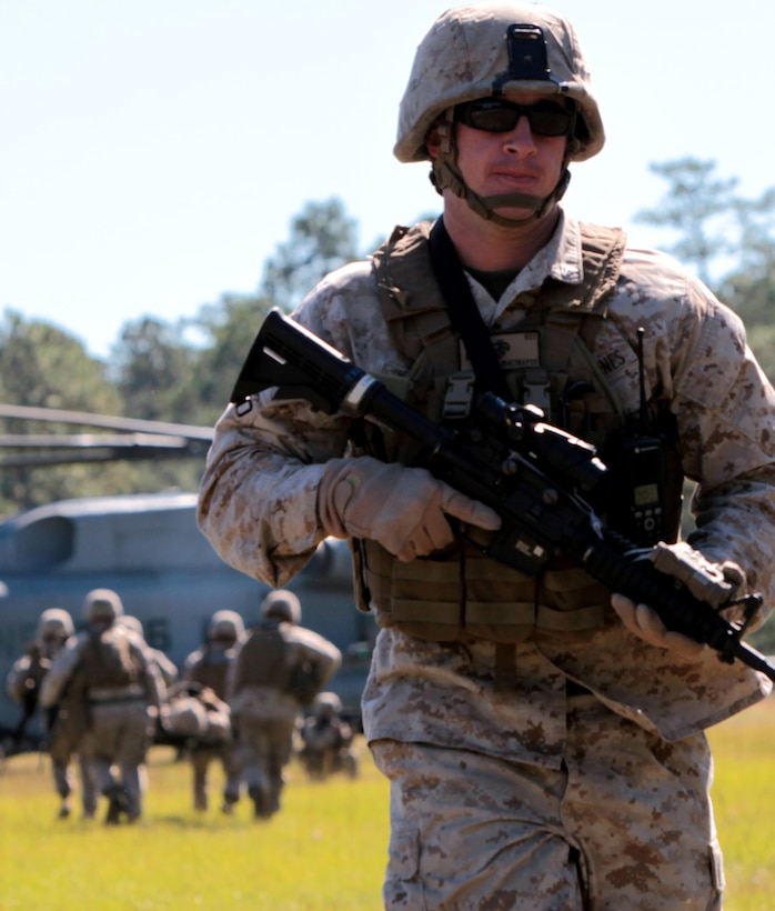 Cpl. Justin Roy, squad leader, 2nd squad, 3rd platoon, Company F, Anti-Terrorism Battalion attached to 2nd Marine Division, walks away from a CH-53E Super Stallion after conducting a casualty evacuation drill aboard Marine Corps Base Camp Lejeune, N.C., Oct. 20. Over the course of the training each platoon performed two casualty evacuation drills in which a junior Marine was responsible for calling in a nine-line medical evacuation request.