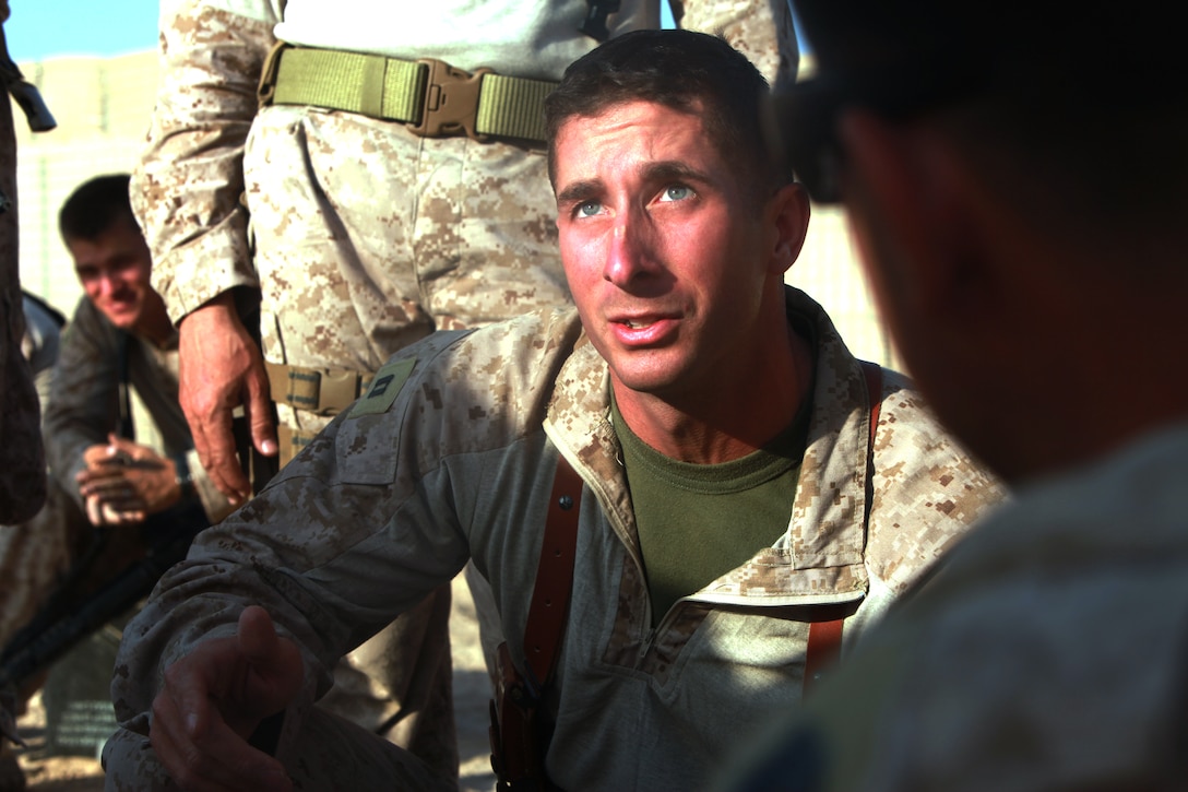 The day before the first mission, Capt. Michael Gagnon briefs his Marines at Patrol Base Alcatraz, Afghanistan, Oct. 20, on the plan to construct a helicopter-landing zone for a special operations outpost in the Helmand River valley. Gagnon, a native of Oxford, Mass., commands a team of roughly 20 men dubbed “Task Force Nomad.” Over the next several weeks, the task force will construct or improve helicopter landing zones along the Helmand River valley in southwestern Afghanistan.