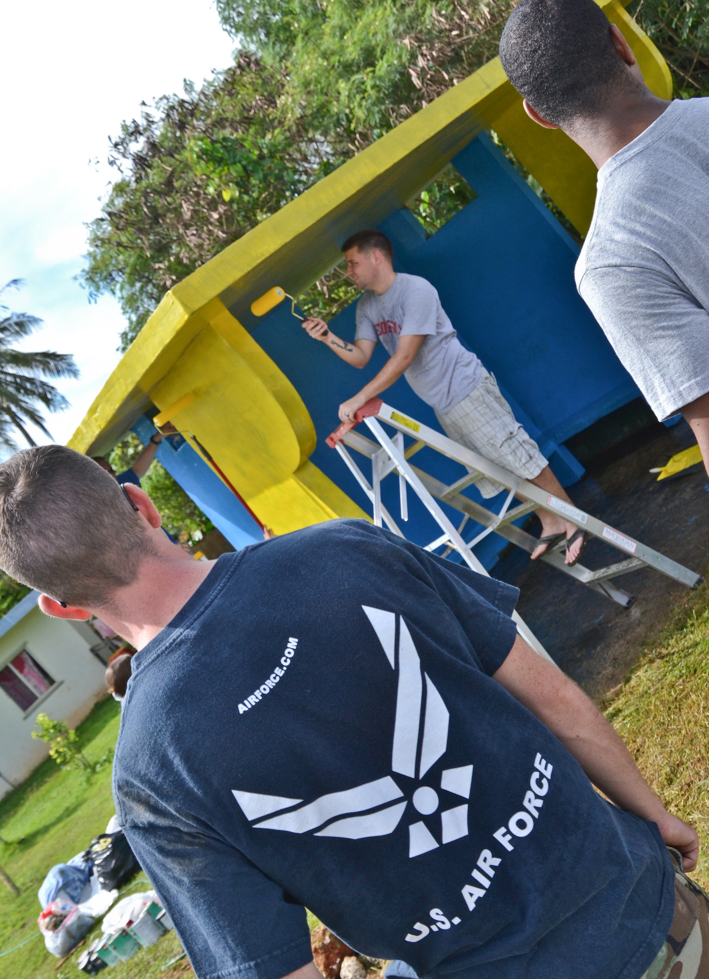 Airmen from the 36th Maintenance Squadron and 36th Wing chapel paint a bus stop for an Island Beautification project in Mangilao, Guam Oct 15.  Throughout the year, squadrons from Andersen AFB volunteer their time to help clean, repair and build areas in Guam communities in support of  the Islandwide Beautification Task Force. (U.S. Air Force photo by Staff Sgt. Alexandre Montes/RELEASED) 