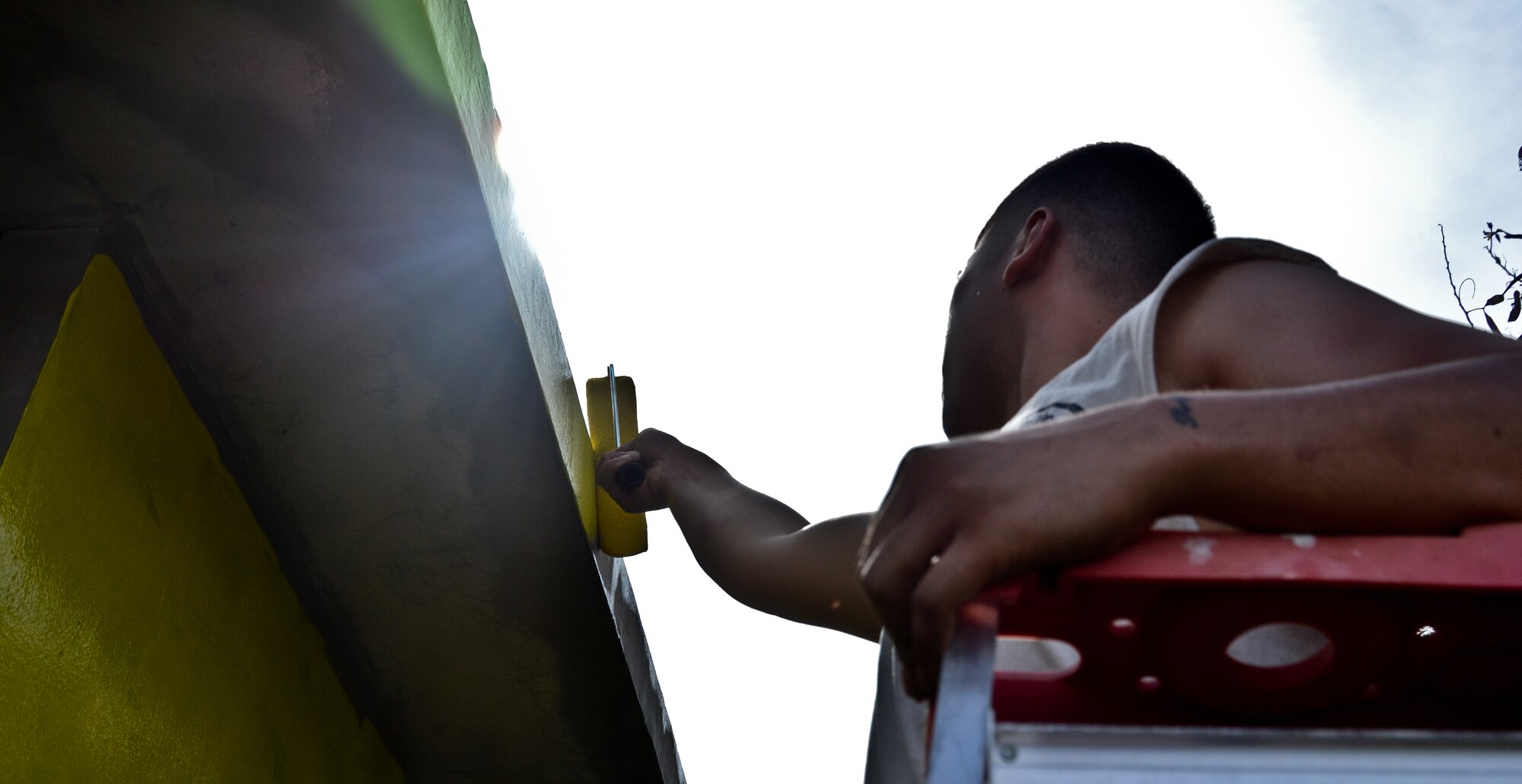 Airmen from the 36th Maintenance Squadron and 36th Wing chapel paint a bus stop for an Island Beautification project in Mangilao, Guam Oct 15.  Throughout the year, squadrons from Andersen AFB volunteer their time to help clean, repair and build areas in Guam communities in support of  the Islandwide Beautification Task Force. (U.S. Air Force photo by Staff Sgt. Alexandre Montes/RELEASED) 