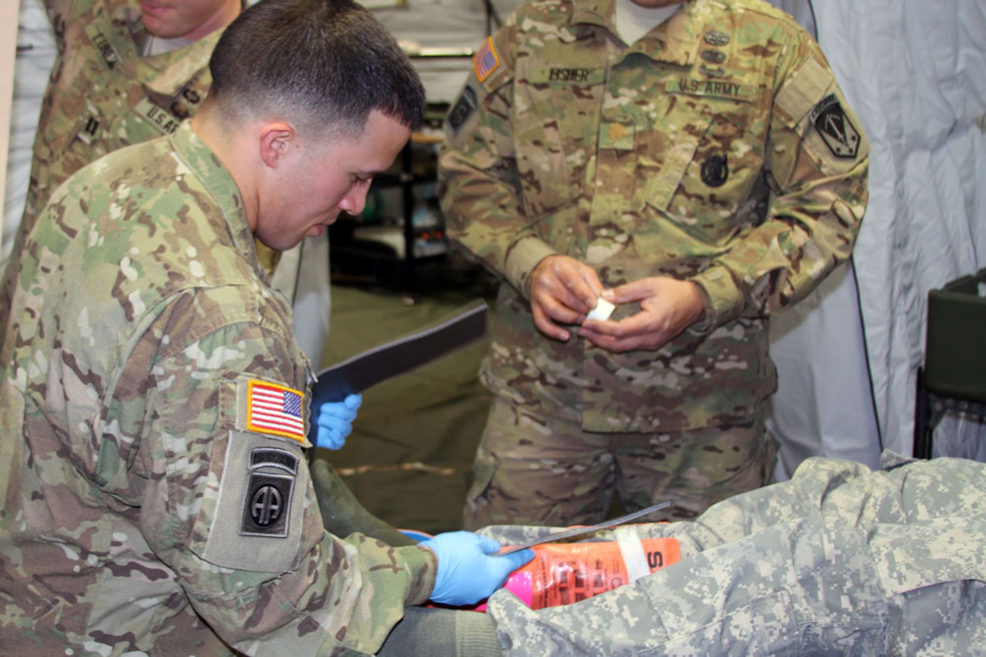 Army Maj. Mike Fisher, 8th Forward Surgical Team (Airborne) deputy commander and chief nurse; and Army Staff Sgt. Nick Lising, operating room technician, prepare to administer simulated anesthetic to a mock trauma patient in training Oct. 12 at Joint Base Elmendorf-Richardson. The 8th FST will train at the Army Trauma Training Center in Miami, Fla., in October, in preparation for an upcoming deployment. (Photo by Army Col. Thomas J. Roth / 2d Engineer Brigade)