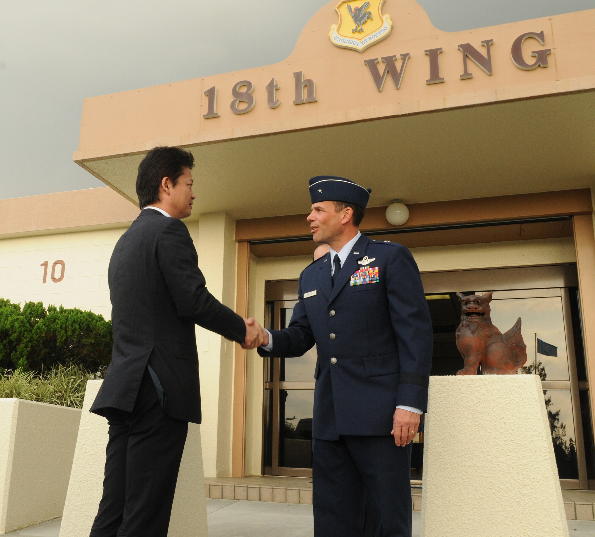 U.S. Air Force Brig. Gen. Matthew H. Molloy, 18th Wing commander, welcomes Japan's Minister of Foreign Affairs, Koichiro Genba, during his site visit to Kadena Air Base, Japan, Oct. 18. During the meeting, the foreign minister extended his appreciation to Okinawa-based U.S. service members for working to ensure peace and stability. (U.S. Air Force photo/Airman 1st Class Jarvie Z. Wallace/released)
