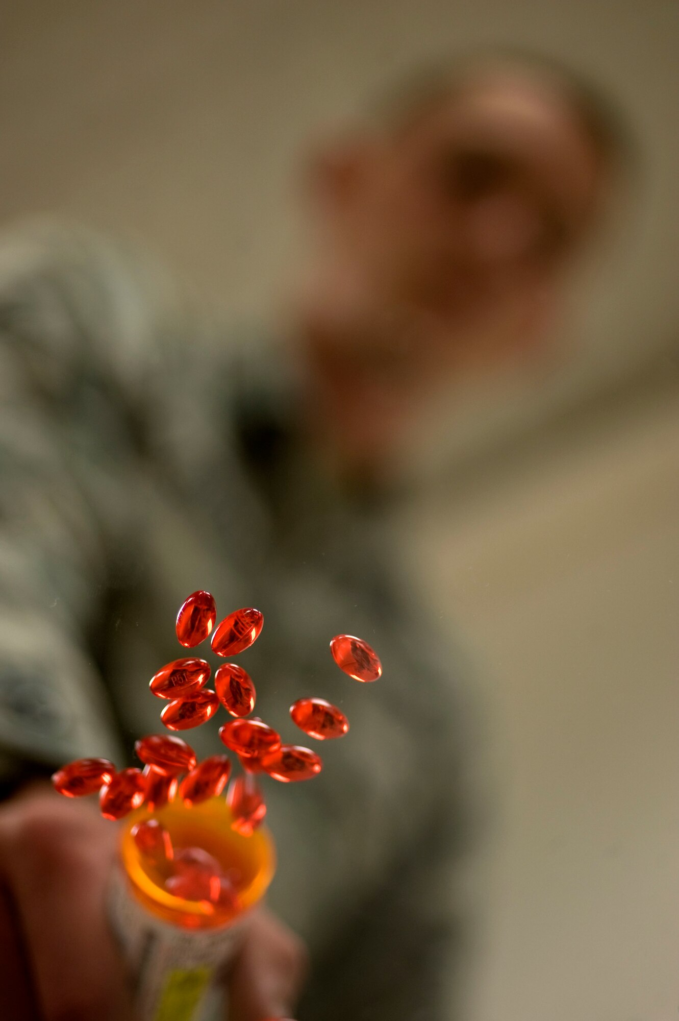 An Airman simulates the improper disposal of out-of-date prescription medication on Hurlburt Field, Fla. Oct. 20, 2011. The 1st Special Operations Medical Group Pharmacy Flight recommends disposing of old medication properly if it is no longer needed. Hurlburt Field will host a National Take Back Initiative event Oct. 29 at the base commissary from 10 a.m. to 2 p.m. The event is open to active-duty service members, civilians, dependents and retired service members. (U.S. Air Force photo/Airman 1st Class Gustavo Castillo)