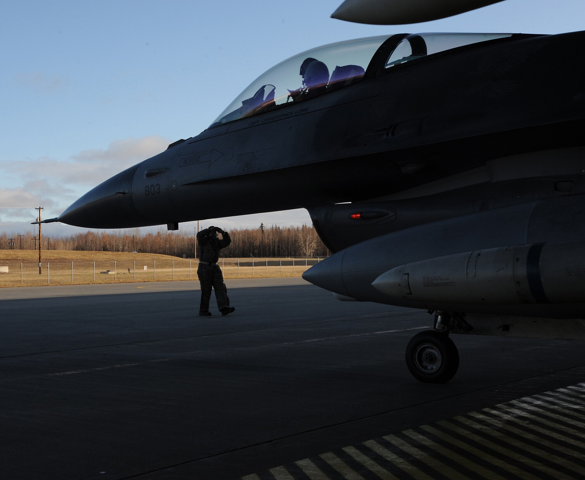 U.S. Air Force Senior Airman Matthew Smith taxies a U.S. Air Force F-16 Fighting Falcon Oct. 12, 2011, Eielson Air Force Base, Alaska. During any particular RED FLAG-Alaska exercise crew chiefs can potentially launch dozens of aircraft apiece.  Smith is a crew chief assigned to the 35th Aircraft Maintenance Squadron, Misawa Air Base, Japan. (U.S. Air Force photo by Senior Airman Willard E. Grande II/Released)