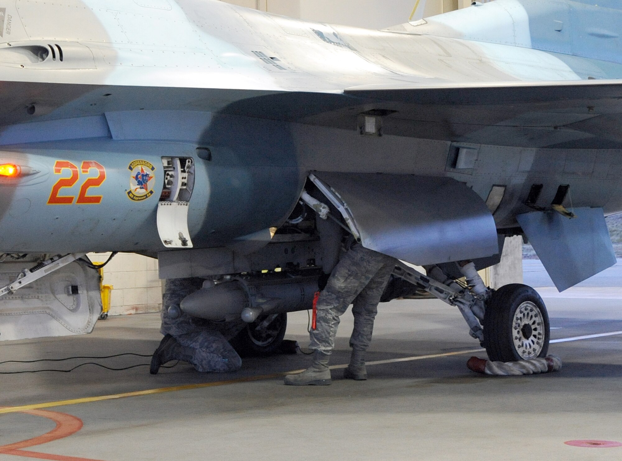 U.S. Air Force Airman 1st Class Lenford Johnston and Paul Wiese conduct preflight inspections on a U.S. Air Force F-16 Fighting Falcon Oct. 12, 2011, Eielson Air Force Base, Alaska. Before every flight, crew chiefs ensure their jets are functioning properly and will be at their peak performance. Johnston and Wiese are crew chiefs assigned to the 354th Aircraft Maintenance Squadron. (U.S. Air Force photo by Senior Airman Willard E. Grande II/Released)