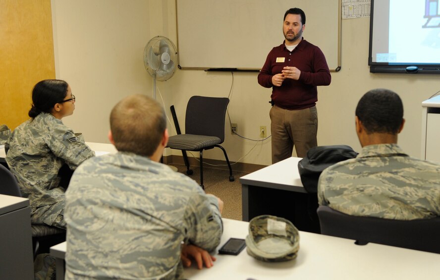 Alejandro Vega, education services counselor, leads a commissioning briefing at the education center Oct. 19 on Barksdale Air Force Base, La. Vega holds the 45-minute briefing every first and third Wednesday for enlisted Airmen looking to advance in their careers through a commissioning program. (U.S. Air Force photo/Airman 1st Class Andrea F. Liechti)(RELEASED)
