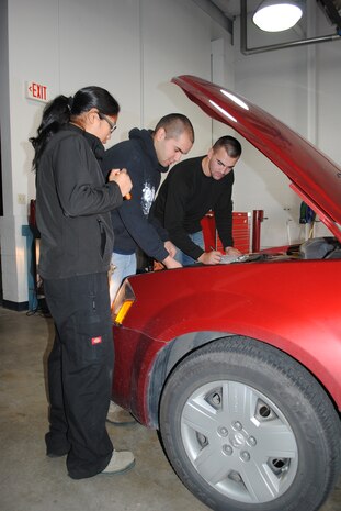 Airmen 1st Class Marilou Leyble, vehicle management analysis, Jaime Perales, vehicle mechanic, and Thomas Hargrove, material manager, all with the 341st Logistics Readiness Squadron, adjust the air filter of a privately owned vehicle. The free POV inspections held on base at Bldg. 870 Oct. 15 and 16 included an inspection of interior and exterior, tires, batteries, fluids, belts, winter tips and more. For any members of Team Malmstrom who missed out on the opportunity to have a free car inspection, the 341st LRS will be doing POV inspections again Oct. 22 and 23 from 10 a.m. to 2 p.m.  (U.S. Air Force photo/Airman 1st Class Katrina Heikkinen)