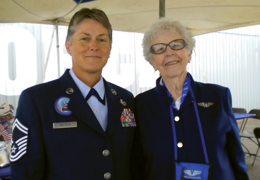 Senior Master Sgt. Regina Brewer escorts Flora Bell Reese, World War II Woman Airforce Service Pilot, during the Midland Airshow in Odessa, Texas, Oct. 7, 2011. Brewer attended the event as a representative of the 442nd Human Resources Development Council, part of the 442nd Fighter Wing. The 442nd FW is an A-10 Thunderbolt II Air Force Reserve unit at Whiteman Air Force Base, Mo. (U.S. Air Force photo/Courtesy photo)