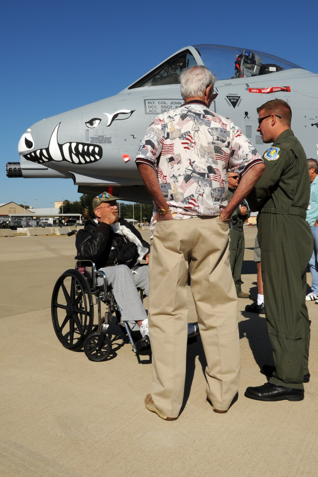 Members of the 98th Bomb Group Veterans Association talk with a 917th Fighter Group pilot about the capabilities of the A-10 Thunderbolt II aircraft at Barksdale Air Force Base, La., Oct. 19, 2011. The 98th held their annual reunion at Barksdale and was given a flight line tour of the aircraft. (U.S. Air Force photo by Master Sgt. Greg Steele/Released)