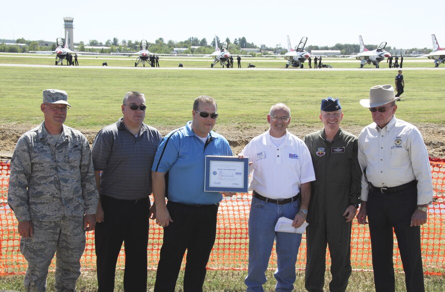 Tech Sgt. Jack R. Daughtery, 188th Fighter Wing member and Benton County Sheriffs Department employee, left, nominated his employer for an Employer Support of the Guard and Reserve (ESGR) Patriot Award. ESGR representative Jon Woodham, third from right, and Col. Tom Anderson, 188th Fighter Wing commander, second from right, presented the award to members of the sheriffs department Sept. 30 at the 188th. (U.S. Air Force photo by Airman 1st Class John Hillier/188th Fighter Wing Public Affairs)