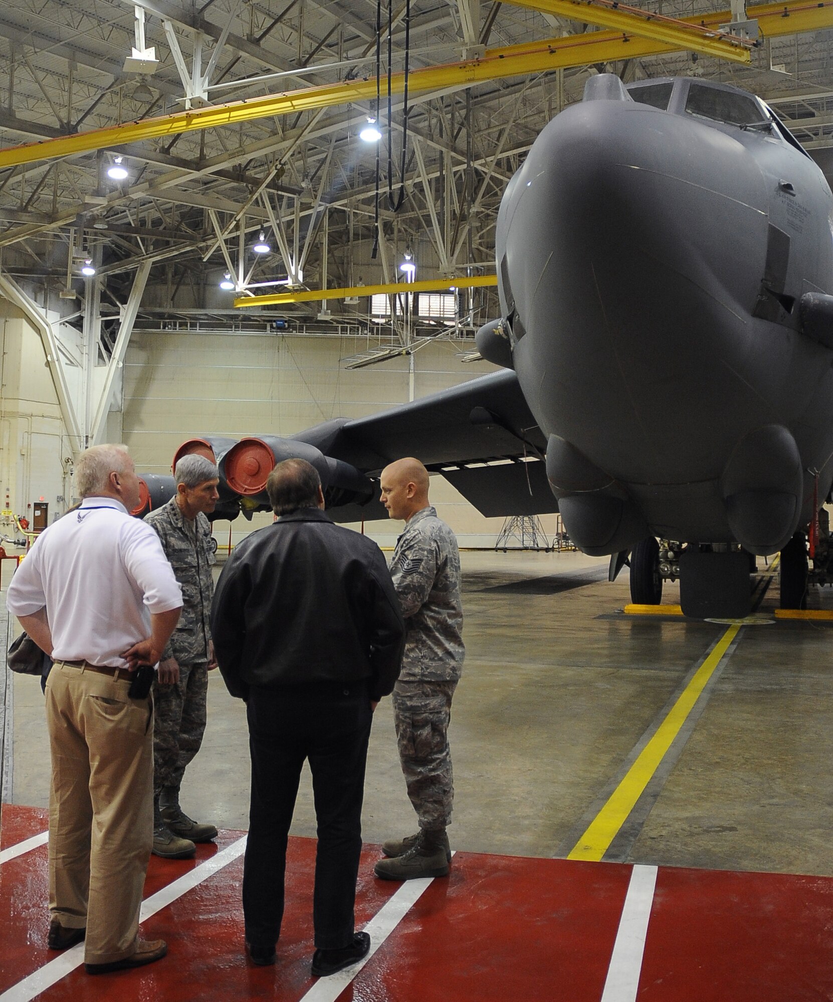 Tech. Sgt. Daniel Vogan, 2nd Maintenance Squadron, speaks with Air Force Chief of Staff Gen. Norton Schwartz and members of the CSAF Civic Leader Program about B-52 Stratofortress capabilities on Barksdale Air Force Base, La., Oct. 18, 2011. Schwartz led a 15-member civic leader delegation during a tour of the 2nd Bomb Wing, 8th Air Force and Air Force Global Strike Command. The CSAF civic leader program is an Air Staff-level program comprised of respected community leaders selected by officials from Air Force major commands, the National Guard Bureau and Headquarters Air Force. (U.S. Air Force photo/Senior Airman Amber Ashcraft)(RELEASED)