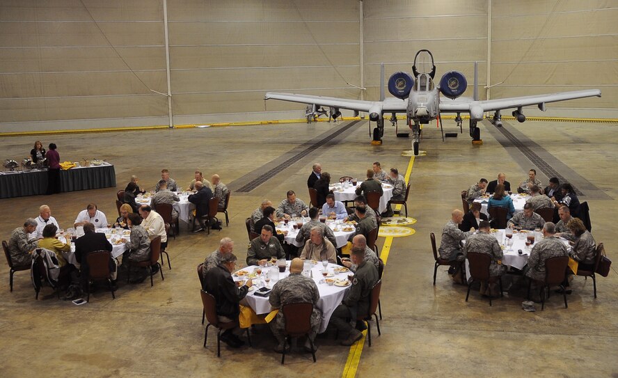Air Force Chief of Staff Gen. Norton Schwartz and several members of the CSAF Civic Leader Program enjoy lunch with Barksdale Airmen in the Phase Hangar on Barksdale Air Force Base, La., Oct. 18, 2011. Schwartz led a 15-member civic leader delegation during a tour of the 2nd Bomb Wing, 8th Air Force and Air Force Global Strike Command. The CSAF civic leader program is an Air Staff-level program comprised of respected community leaders selected by officials from Air Force major commands, the National Guard Bureau and Headquarters Air Force.  (U.S. Air Force photo/Senior Airman Amber Ashcraft)(RELEASED)