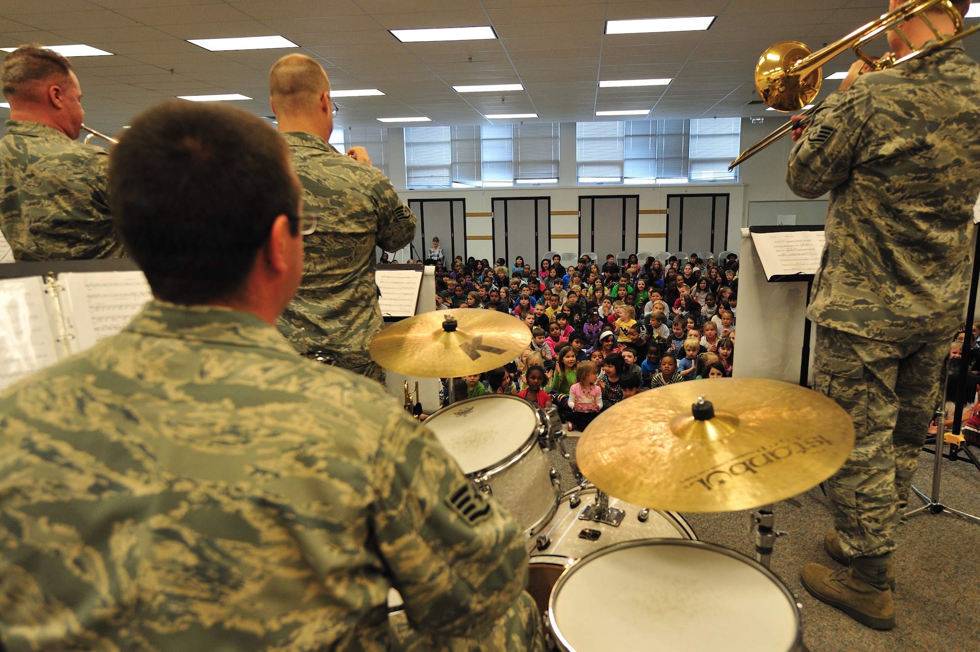 U.S. Air Force Band of the Pacific's Alaska Brass members perform for grades K-6 at Ursa Major Elementary School on Joint Base Elmendorf-Richardson, as part of Red Ribbon Week, Oct. 19. The Red Ribbon Week is the oldest and largest drug-free campaign in the country, and raises awareness in youth nationwide to make the right decisions to stay away from drugs. (U.S. Air Force photo/Staff Sgt. Sheila deVera)