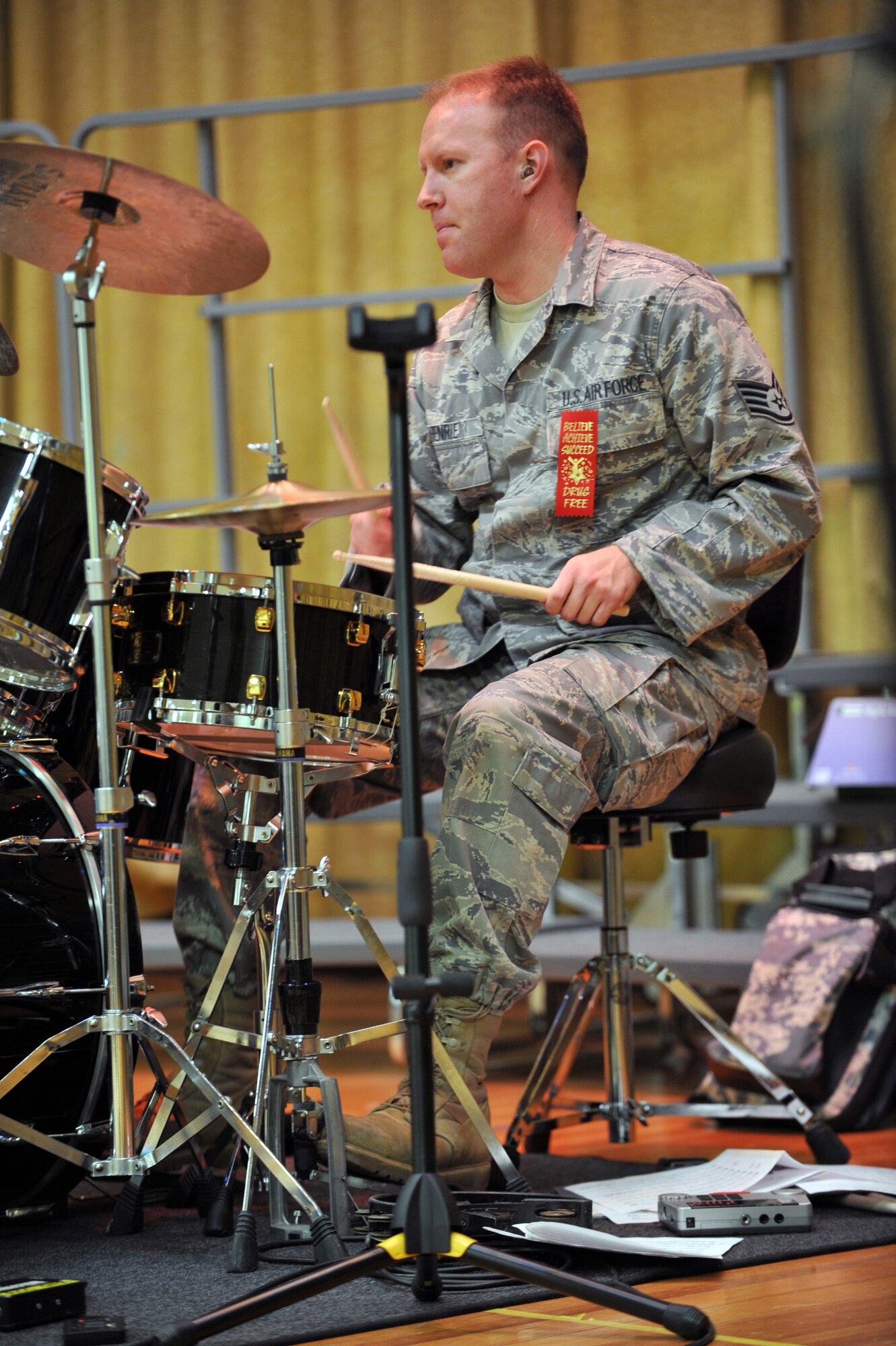 Staff Sgt. Michael Henrie, drummer for Alaskan Express, part of the U.S. Air Force Band of the Pacific, performs for students from the Aurora Elementary School, Joint Base Elmendorf-Richardson, Alaska, during Red Ribbon week, Oct. 18. The band was there to support the message of this year's drug-free campaign, "It's up to me to be drug free". (U.S. Air Force Photo/Airman 1st Class Ty-Rico Lea)