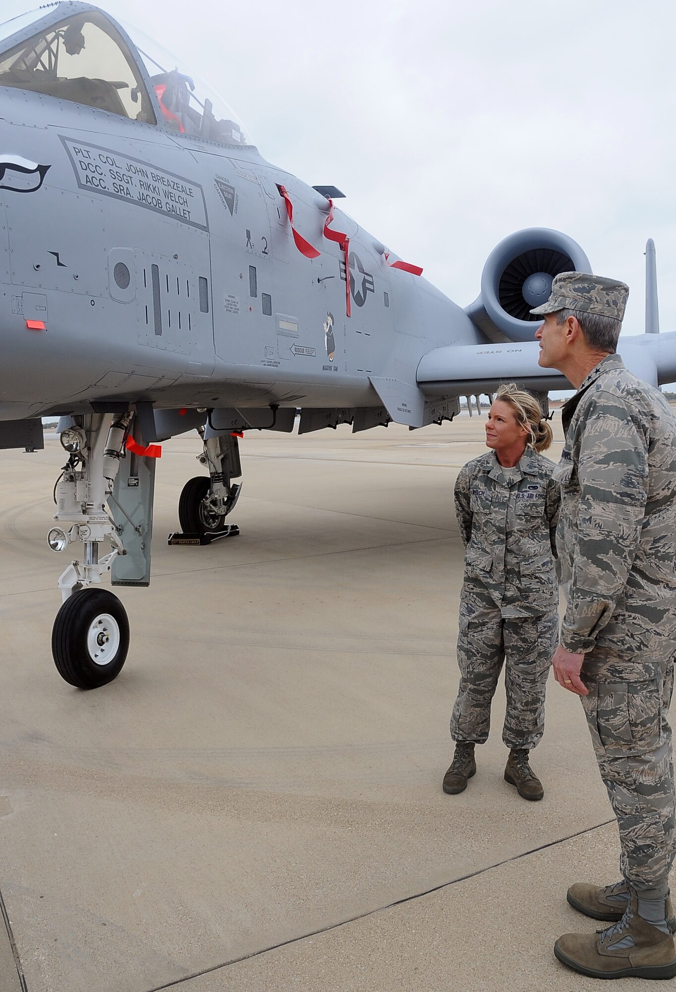 Air Force Chief of Staff Gen. Norton Schwartz speaks with Staff Sgt. Rikki Welch, 917th Maintenance Squadron, about an A-10 Thunderbolt II during a visit to Barksdale Air Force Base, La., Oct. 18, 2011. Schwartz led a 15-member civic leader delegation during a tour of the 2nd Bomb Wing, 8th Air Force and Air Force Global Strike Command.  The CSAF civic leader program is an Air Staff-level program comprised of respected community leaders selected by officials from Air Force major commands, the National Guard Bureau and Headquarters Air Force. (U.S. Air Force photo/Senior Airman Amber Ashcraft)(RELEASED)