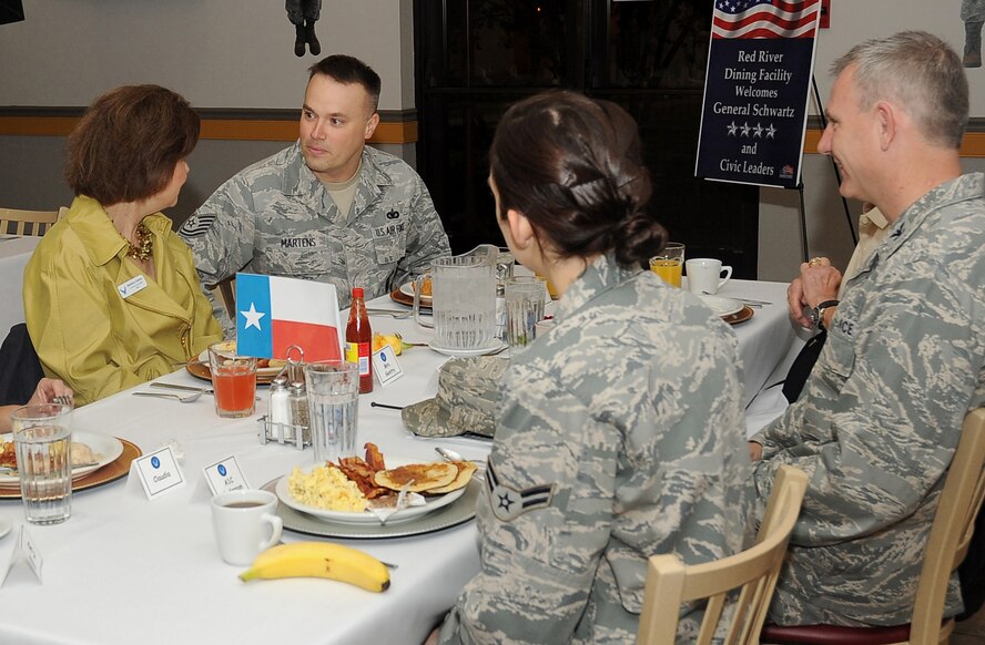 Tech. Sgt. Kevin Martens, 2nd Security Forces Squadron, speaks with Barbara Gentry, Senior Vice President of Community Affairs at USAA, during an Air Force Chief of Staff Civic Leader Program breakfast at the Red River Dining Facility on Barksdale Air Force Base, La., Oct. 18, 2011. Air Force Chief of Staff Gen. Norton Schwartz led a 15-member delegation during a tour of the 2nd Bomb Wing, 8th Air Force and Air Force Global Strike Command.  The CSAF civic leader program is an Air Staff-level program comprised of respected community leaders selected by officials from Air Force major commands, the National Guard Bureau and Headquarters Air Force. (U.S. Air Force photo/Senior Airman Amber Ashcraft)(RELEASED)