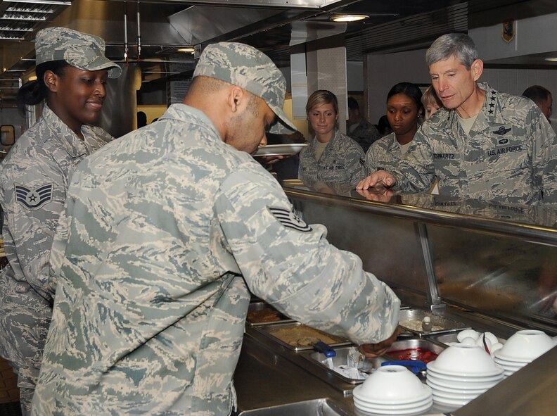 Air Force Chief of Staff Gen. Norton Schwartz chooses items for breakfast from the Red River Dining Facility on Barksdale Air Force Base, La., Oct. 18, 2011. Fifteen civic leaders accompanied the general on a tour of Air Force Global Strike Command bases.  The CSAF civic leader program is an Air Staff-level program comprised of respected community leaders selected by officials from Air Force major commands, the National Guard Bureau and Headquarters Air Force. (U.S. Air Force photo/Senior Airman Amber Ashcraft)(RELEASED)