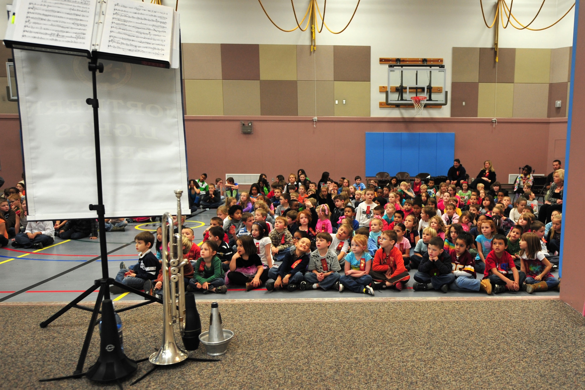 Students at Mt. Spurr Elementary School wait patiently for the U.S. Air Force Band of the Pacific, Northern Lights Brass, to perform at Joint Base Elmendorf-Richardson, during Red Ribbon week, Oct. 12. The band performed at different schools to support the message of this year's drug-free campaign, "It's up to me to be drug free." (U.S. Air Force photo/Staff Sgt. Sheila deVera)