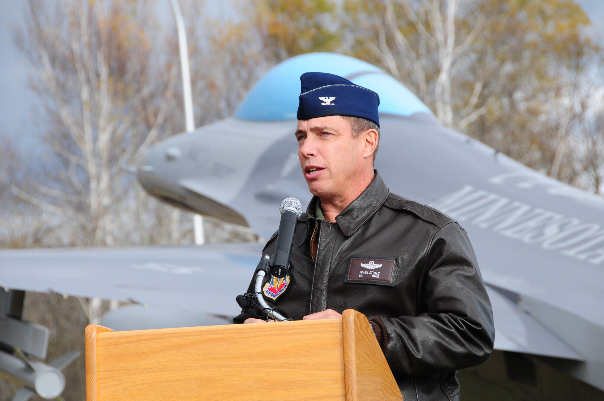 Col. Frank H. Stokes, 148th Fighter Wing Commander, speaks during the F-16 static display dedication ceremony at the entrance to the 148th Fighter Wing, Oct. 19, 2011.  Ceremony attendees included business and civic leaders, and 148th Fighter Wing members that helped to make the static display a reality.  (National Guard photo by Tech. Sgt. Scott G. Herrington.)
