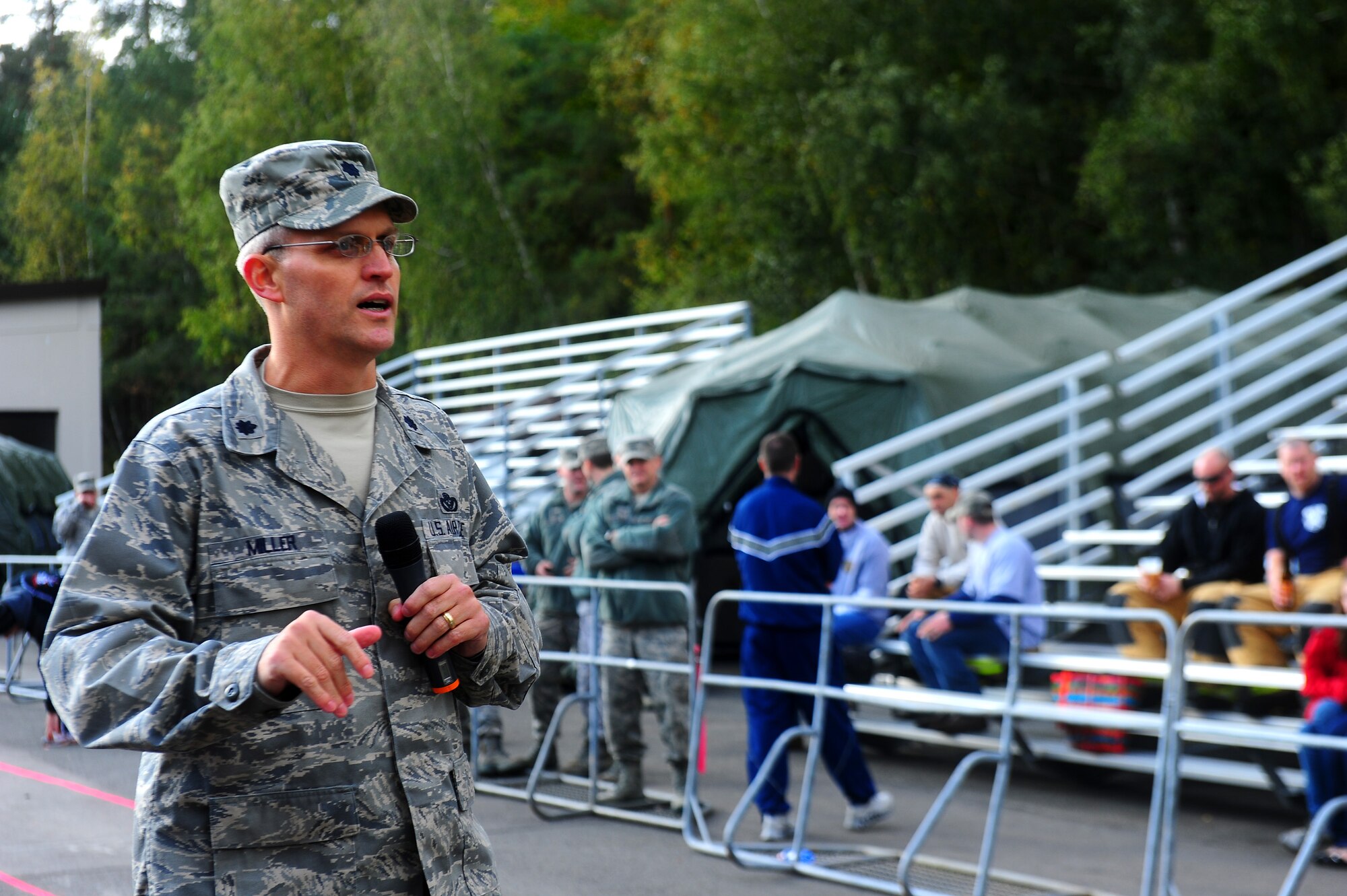 Air Force Lt. Col. Michael Miller, 435th Construction and Training Squadron commander, addresses guests at the 435th CTS Firefighter Combat Challenge, Ramstein Air Base, Germany, Oct. 20, 2011. The event promoted physical fitness and enhanced camaraderie between firefighters within U.S. Air Forces in Europe. Winners will continue on to the final challenge held in Myrtle Beach, S.C., Nov. 14-19, 2011. (U.S. Air Force photo by Airman 1st Class Brea Miller)