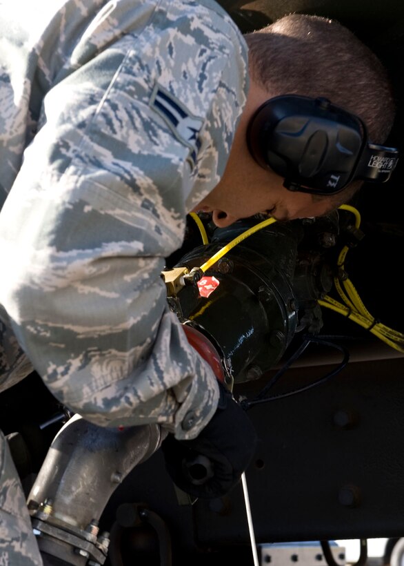 Airman 1st Class Ethan Brown, 28th Logistics Readiness Squadron fuels distributer, carefully attaches a fuel hose to a fuels distribution vehicle during the U.S. Air Force Logistics Compliance Assessment Program inspection on Ellsworth Air Force Base, S.D., Oct. 5, 2011. The LCAP is a very thorough inspection based on a graded assessment with percentage scores on a five-tier rating scale (outstanding, excellent, satisfactory, marginal and unsatisfactory). (U.S. Air Force Photo by Airman 1st Class Kate Thornton/Released)