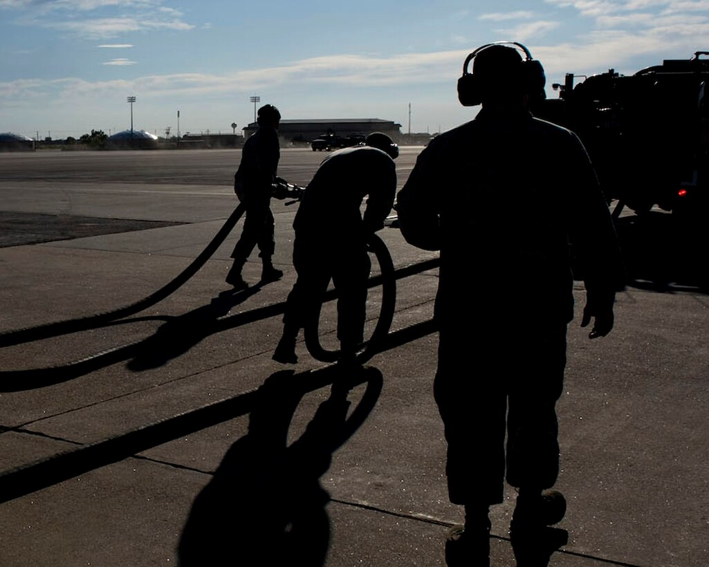 Airmen from the 28th Logistics Readiness Squadron transfer fuel from underground tanks to fuel a transportation vehicle during a U.S. Air Force Logistics Compliance Assessment Program inspection on Ellsworth Air Force Base, S.D., Oct. 5, 2011. To ensure mission success, LCAP inspectors pay close attention to how Airmen do each task outlined in technical orders, Air Force instructions, checklists and locally established guidance. (U.S. Air Force Photo by Airman 1st Class Kate Thornton/Released) 