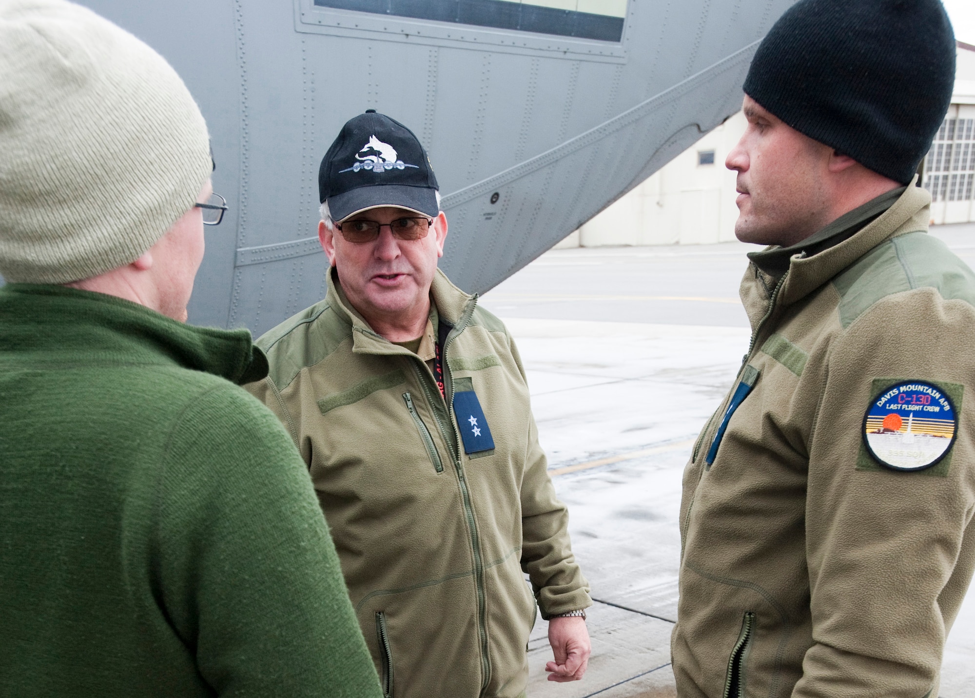 JOINT BASE ELMENDORF-RICHARDSON, Alaska -- Royal Norwegian Air Force Warehouse Manager Steinar Elverhoy, center, talks with Lt. Jan  Motland, left and Capt. Morten Johansen shortly after their C-130 Hercules landed after a training during Red Flag-Alaska Oct. 13. This was the first time the RNAF has participated in RF-Alaska. Twenty-three airmen from the 135th Air Wing, Gardermoen Air Station, Norway participated in the exercise Oct. 6 to Oct. 21. (U.S. Air Force photo/Senior Airman Christopher Gross)