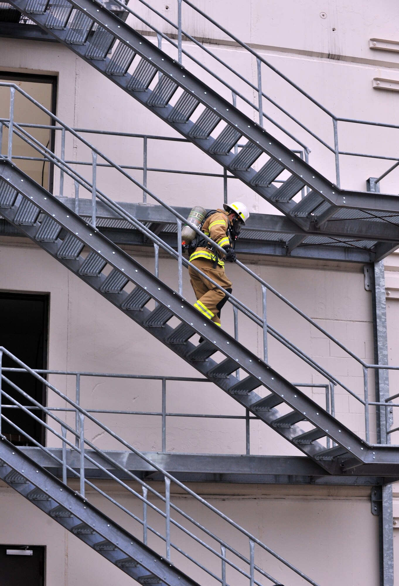 Air Force Master Sgt. Lloyd Stinson, 31st Civil Engineer Squadron firefighter, participates in the stair climb during the 435th Construction and Training Firefighter Combat Challenge, Ramstein Air Base, Germany, Oct. 20, 2011. The event promoted physical fitness and enhanced camaraderie between firefighters within U.S. Air Forces in Europe. The winners will continue on to the final challenge held in Myrtle Beach, S.C., Nov 14-19, 2011. U.S. Air Force photo by Airman First Class Caitlin O'Neil-McKeown)