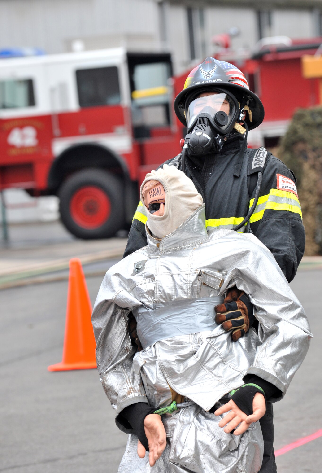Air Force Tech. Sgt. Gary Day, 52nd Civil Engineer Squadron firefighter, drags a dummy for the victim rescue event during the 435th Construction and Training Firefighters Combat Challenge, Ramstein Air Base, Germany, Oct. 20, 2011. The event promoted physical fitness and enhanced camaraderie between firefighters within U.S. Air Forces in Europe. The winners will continue on to the final challenge held in Myrtle Beach, S.C., Nov 14-19, 2011. (U.S. Air Force photo by Airman First Class Caitlin O'Neil-McKeown)