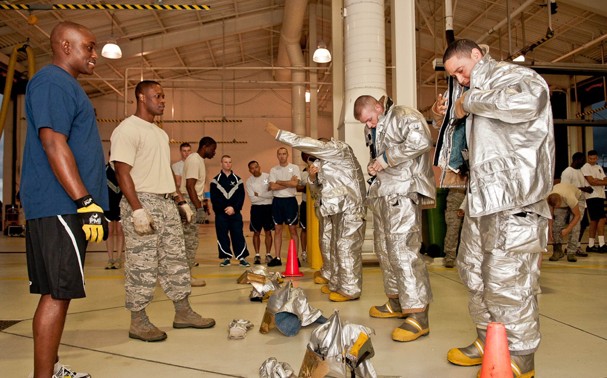 Participants don fire gear as quickly as possible during the Fire Muster Competition, Oct. 14, at the Lajes Fire Department.  The competition was one of 20 events that took place during Lajes' Fire Prevention Week, Oct. 9-15.  (Photo by Lucas Silva)