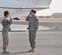 Techn. Sgt. Tennille Benton, 386th Air Expeditionary Wing protocol NCO in charge, salutes Brig. Gen. Karen Ledoux, commanding general, Army Materiel Command-Southwest Asia/G-4, United States Army Central, as she arrives to the 386th Air Expeditionary Wing Oct. 20, 2011, at an undisclosed location in Southwest Asia. (U.S. Air Force photo by Senior Airman Rachelle Elsea)