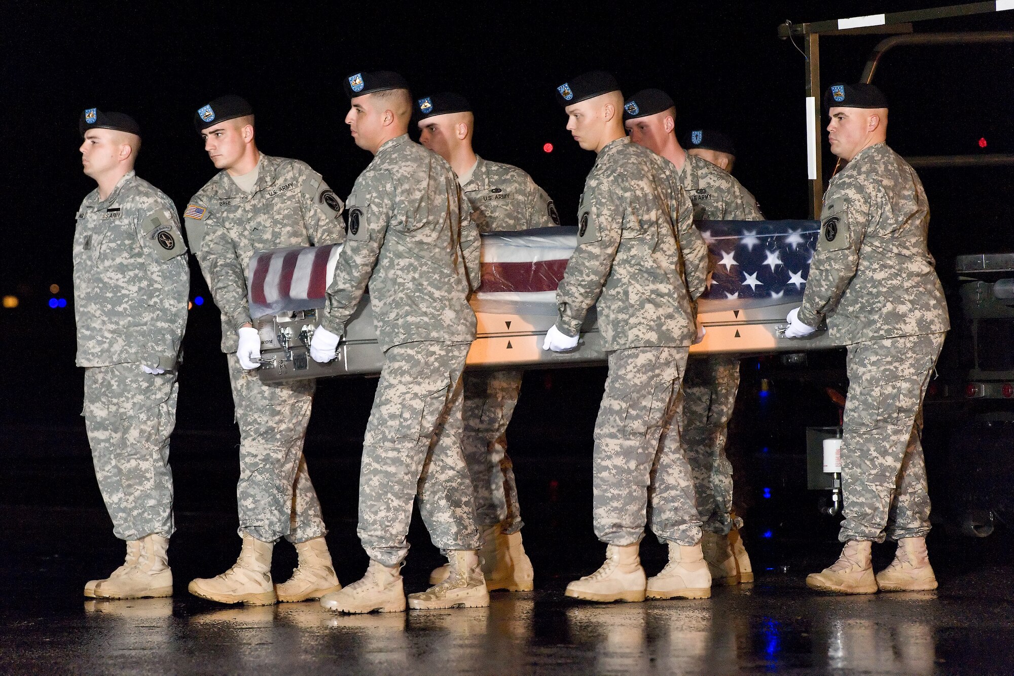 A U.S. Army carry team transfers the remains of Army Spc. Michael D. Elm, of Phoenix, Ariz., at Dover Air Force Base, Del., Oct. 20, 2011. Elm was assigned to the 1st Battalion, 26th Infantry Regiment, 3rd Brigade Combat Team, 1st Infantry Division, Fort Knox, Ky. (U.S. Air Force photo/Roland Balik)