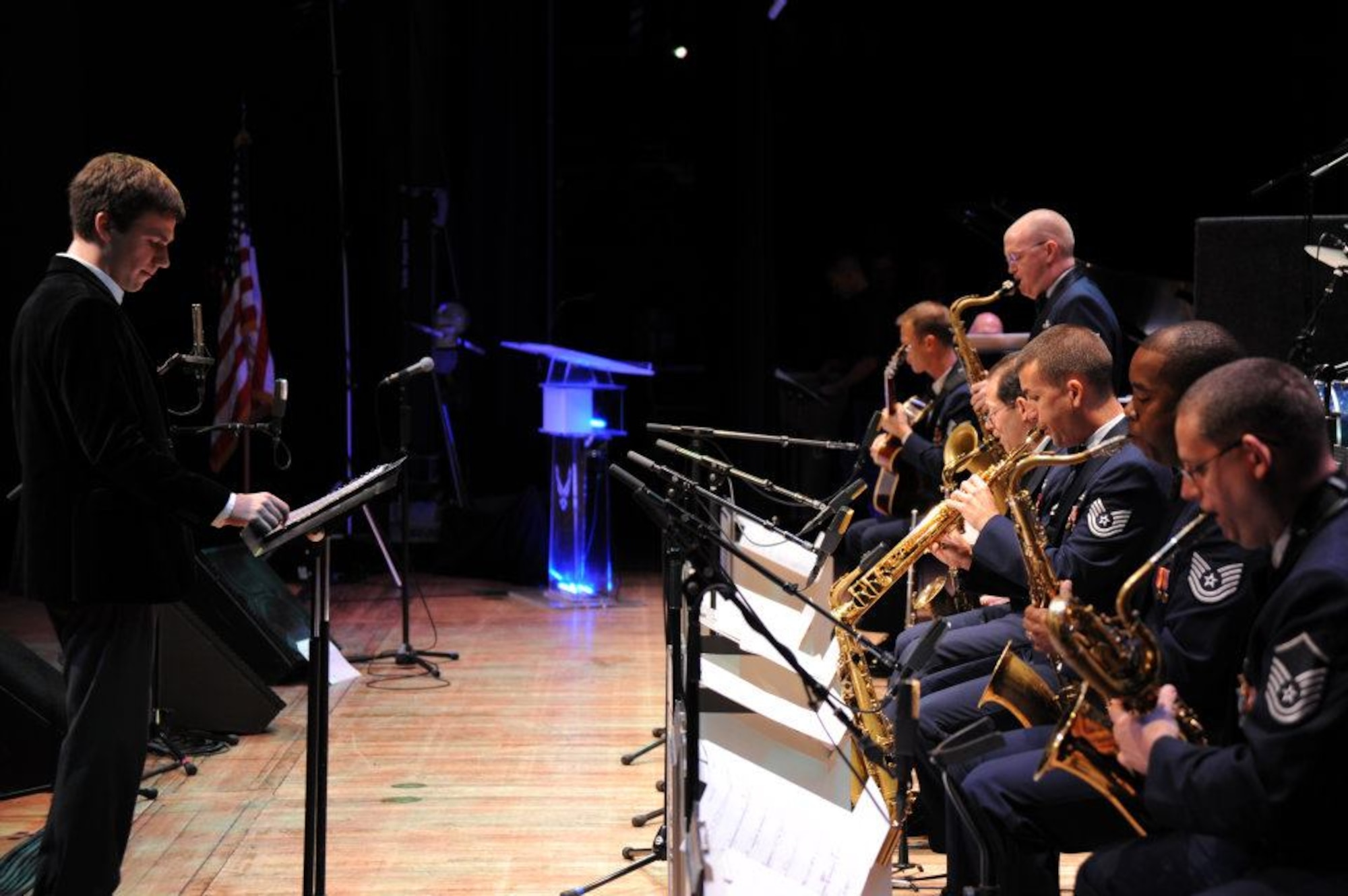 The USAF Airmen of Note saxophone section performs as 2011 Sammy Nestico Award winner Scott Ninmer looks on