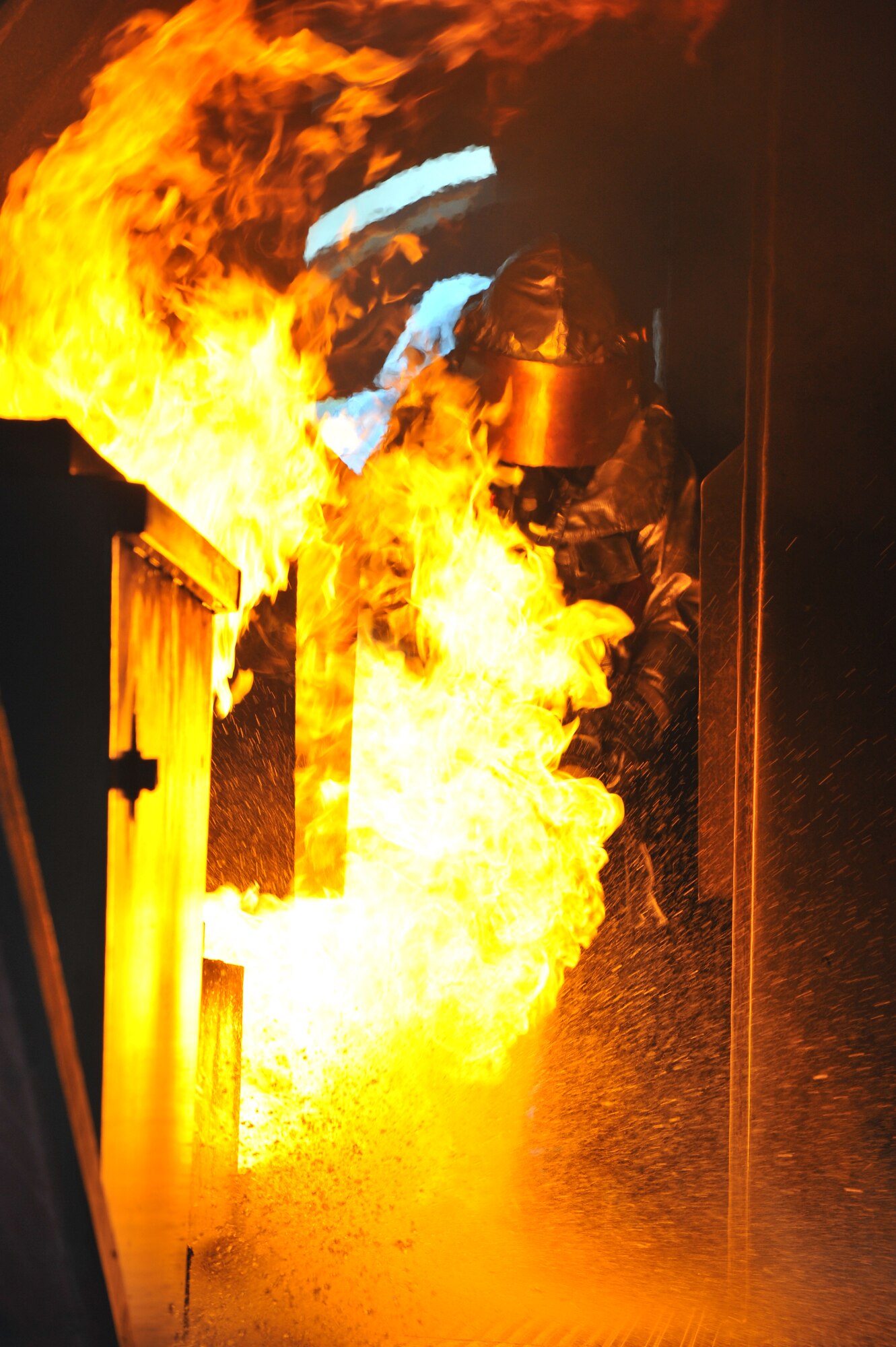 RAMSTEIN AIR BASE, Germany – Firefighters from the 52nd Civil Engineer Squadron Fire Protection Flight extinguish an internal aircraft fire on a mock aircraft during live fire training here Oct. 19. Live fire training is mandatory for firefighters to complete twice a year. The training ensures firefighters are able to perform required core tasks in the event of an aircraft fire to protect lives and U.S. government assets. (U.S. Air Force photo/Airman 1st Class Dillon Davis)