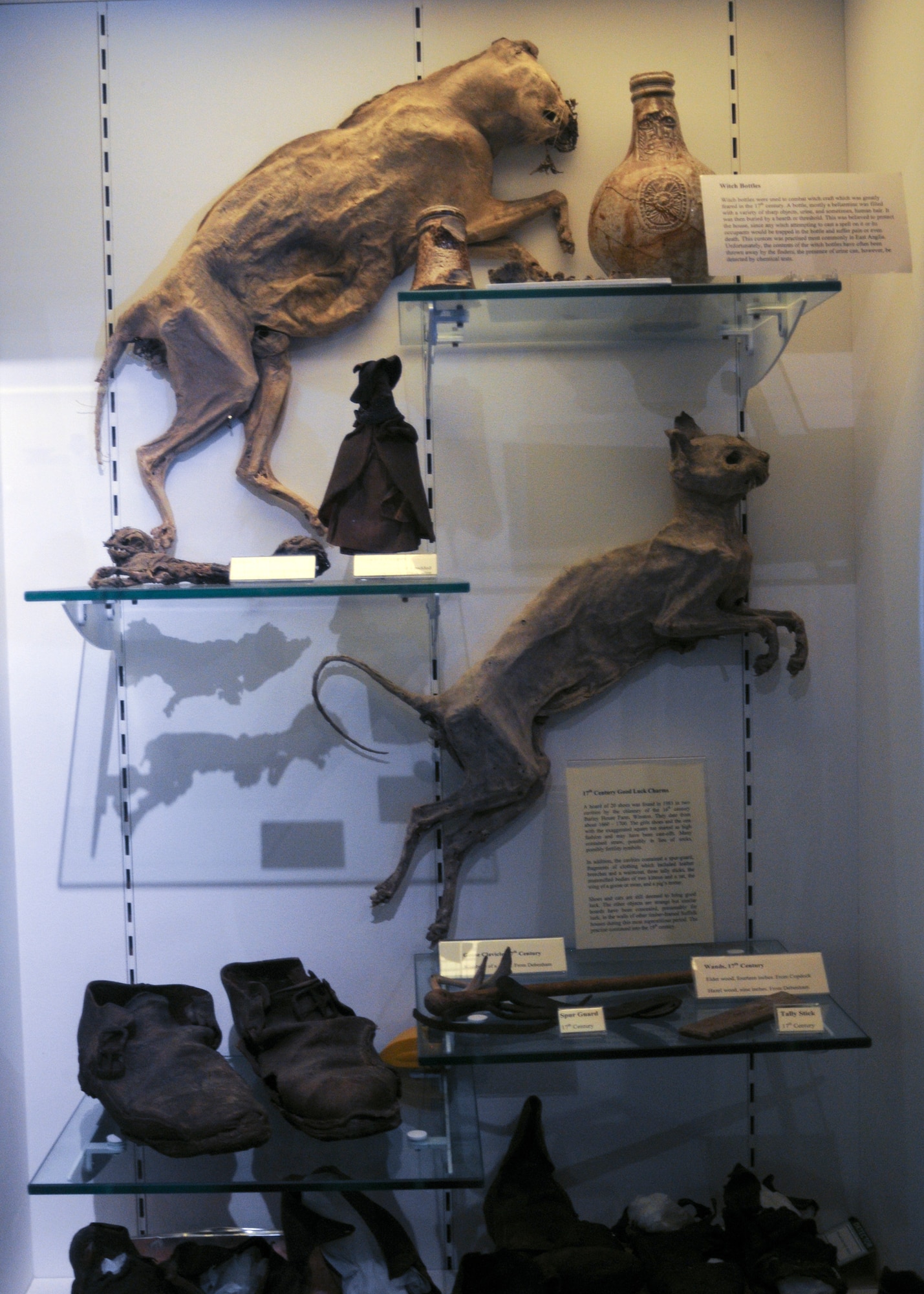 RAF MILDENHALL, England – Mummified cats, shoes and witch bottles are on display at Moyse’s Hall in Bury St. Edmunds. In the 16th and 17th Centuries, many believed witches drew their powers from the devil through small animals, or familiars, which were more susceptible to convey dark powers. Ironically, non-witches would often brick a living cat into their walls during construction, believing that when the cat died in those walls, its spirit would attach itself to the home and protect it. (U.S. Air Force photo/Tech. Sgt. Kevin Wallace)   