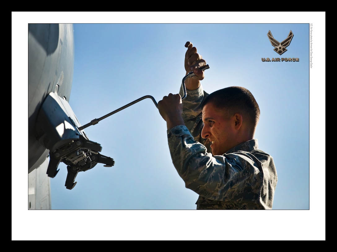 Weapons load crew 18x24 inches @ 300 PPI (U.S. Air Force photo/layout by Airman 1st Class George Goslin/Released)

