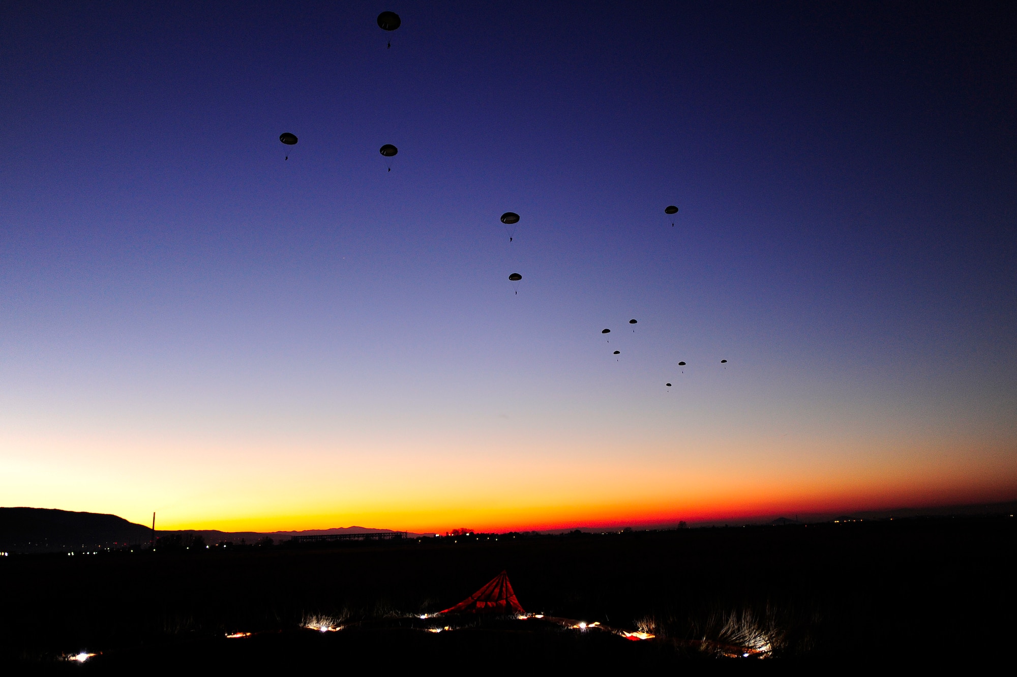 U.S. and Bulgarian paratroopers float to the ground after jumping from a C-130J Super Hercules aircraft during Operation Thracian Fall 2011, Oct. 19, 2011, in Plovdiv, Bulgaria. OTF11 is off-station training designed to enhance interoperability between U.S. and Bulgarian Air Forces as well as build partnerships with paratroopers from both. (U.S. Air Force photo by Senior Airman Stephen J. Otero)