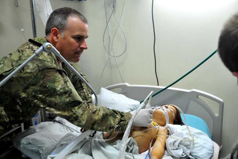Lt. Col. Derrick Willsey performs an ultrasound on the lung of  Roquia, an Afghan child, Oct. 10, 2011. Willsey is part of the Special Operations Surgical Team, deployed from the 1st Special Operations Support Squadron at Hurlburt Field, Fla.  The SOST team provides medicine to disadvantaged people, provides direct patient care, and builds relationships with local doctors. (U.S. Air Force Photo/SrA Tyler Placie)