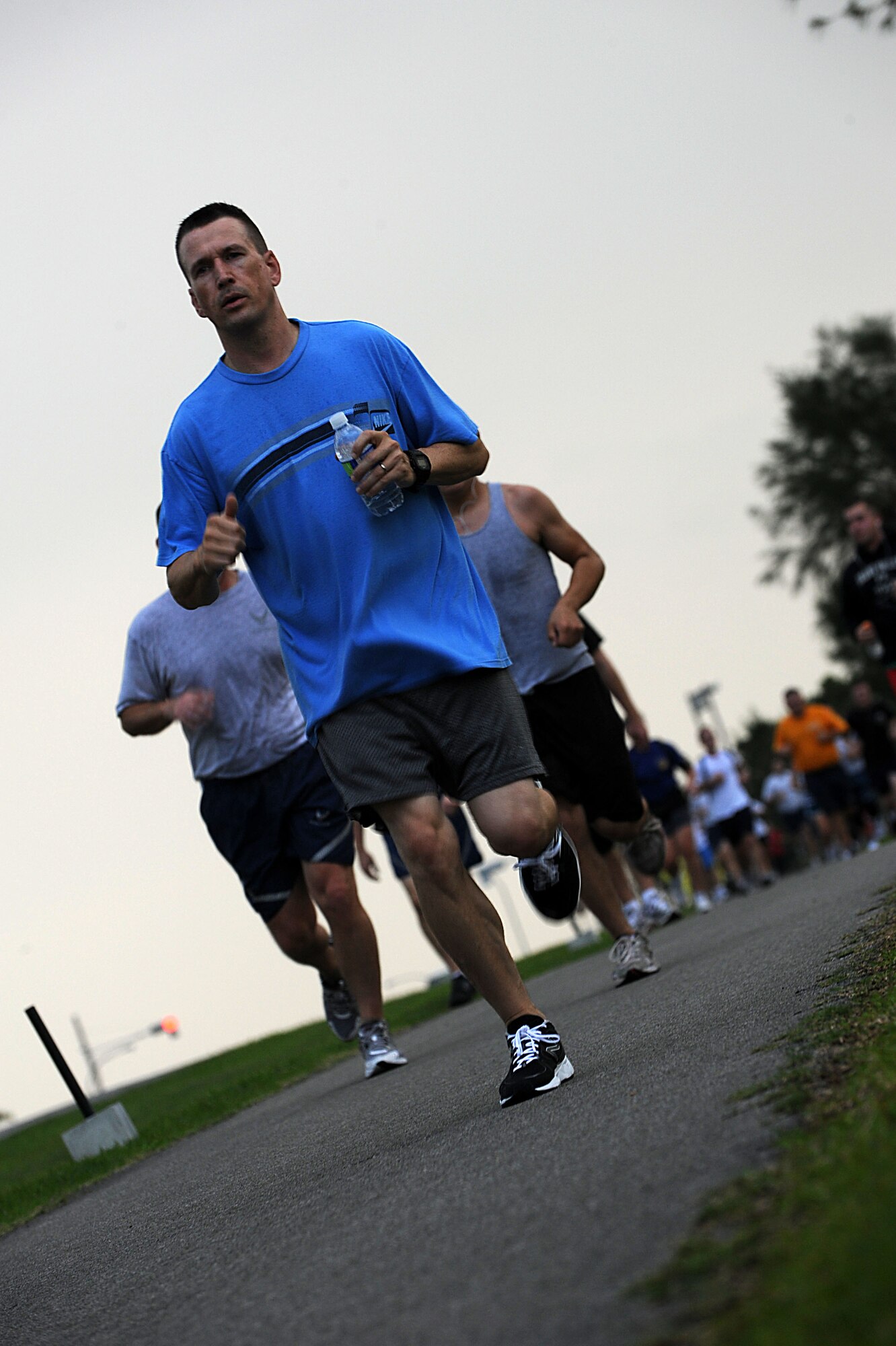 U.S. Service members participate in the Kadena Special Olympics 24-hour jog-a-thon at Marek Park on Kadena Air Base, Japan, Oct. 19. The jog-a-thon was held to raise money for the 12th annual Kadena Special Olympics, Nov. 5. (U.S. Air Force photo/Airman 1st Class Brooke P. Beers/Released)