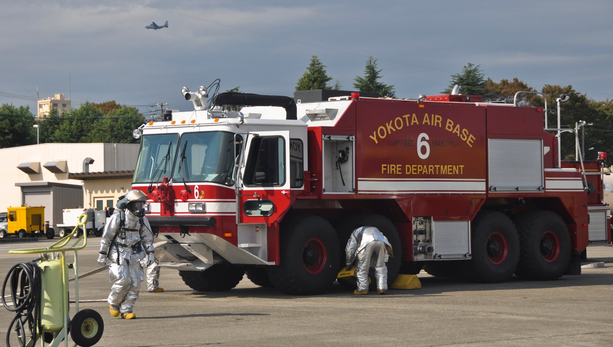 YOKOTA AIR BASE, Japan -- Firefighters from the 374th Civil Engineer Squadron put away their supplies after training at Yokota Air Base, Japan, Oct. 18, 2011. The 374th CES firefighters train regularly for aircraft fire responses. (U.S. Air Force photo/Airman John D. Partlow)