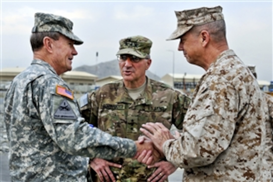 U.S. Army Gen. Martin E. Dempsey, chairman of the Joint Chiefs of Staff, meets with U.S. Marine Corps Gen. John R. Allen, commander of U.S. and international forces in Afghanistan, and U.S. Army Lt. Gen. Curtis Scaparrotti, Joint Command commander of the International Security Assistance Force on the military side of Kabul International Airport in Kabul, Afghanistan, Oct. 20, 2011. This was Dempsey's first visit to Regional Command Capital in Kabul since assuming command as chairman.