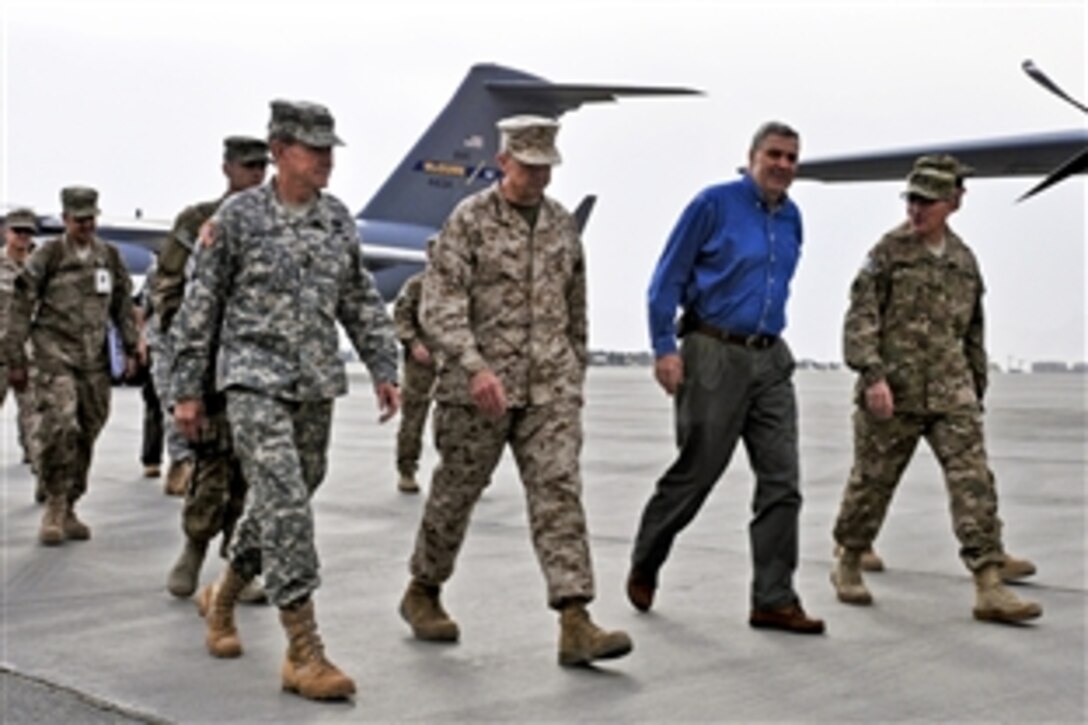 U.S. Army Gen. Martin E. Dempsey, chairman of the Joint Chiefs of Staff, left, walks with U.S. Marine Corps Gen. John R. Allen, commander of U.S. and international forces in Afghanistan, and U.S. Army Lt. Gen. Curtis Scaparrotti, Joint Command commander of the International Security Assistance Force, on the military side of Kabul International Airport in Kabul, Afghanistan, Oct. 20, 2011. This was Dempsey's first visit to Regional Command Capital in Kabul since assuming command as chairman.