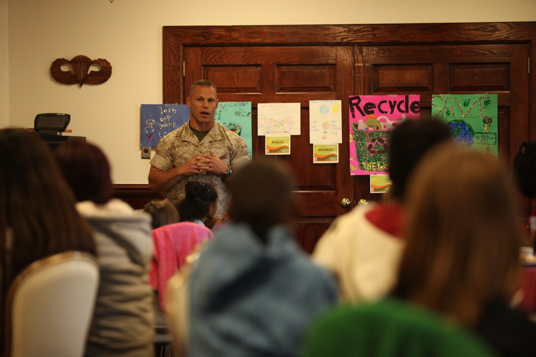 Col. Daniel J. Lecce, commanding officer of Marine Corps Base Camp Lejeune, speaks with members of the Torch, Keystone and Smart Girls clubs at the Youth Leadership Luncheon for energy awareness, at the Paradise Point Officers’ Club aboard the base, Oct. 21.